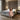 Springfit Autograph Prive mattress on a grey upholstered bed in a modern luxury bedroom with wood slat wall panels and globe pendant lights, with a brand ambassador seated on the mattress edge in a floral dress