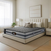 Springfit BetterSpine Elevate mattress on a cream upholstered bed frame with neutral pillows in a bright minimalist bedroom