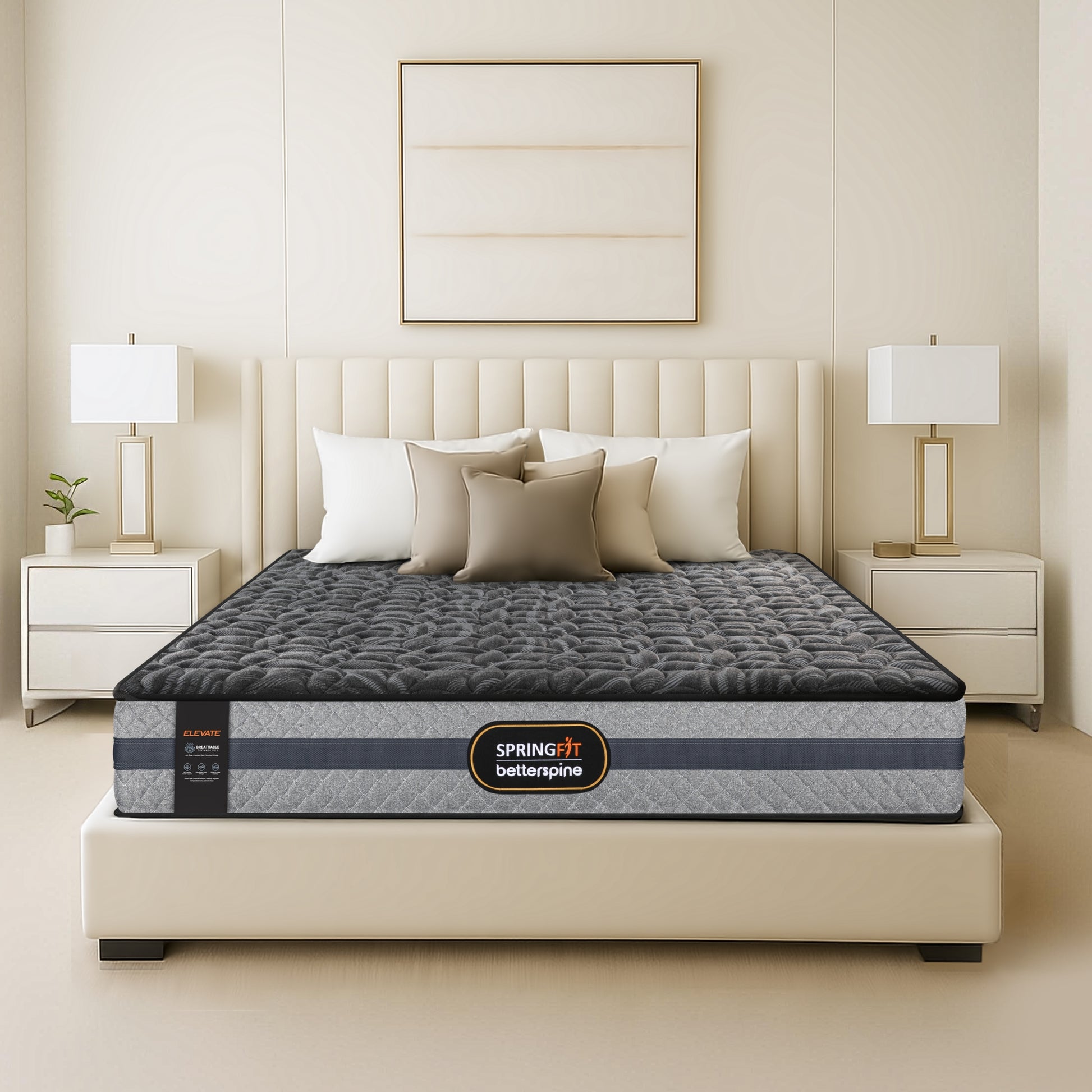 Front view of Springfit BetterSpine Elevate mattress with dark charcoal quilted top and beige pillows on cream upholstered bed