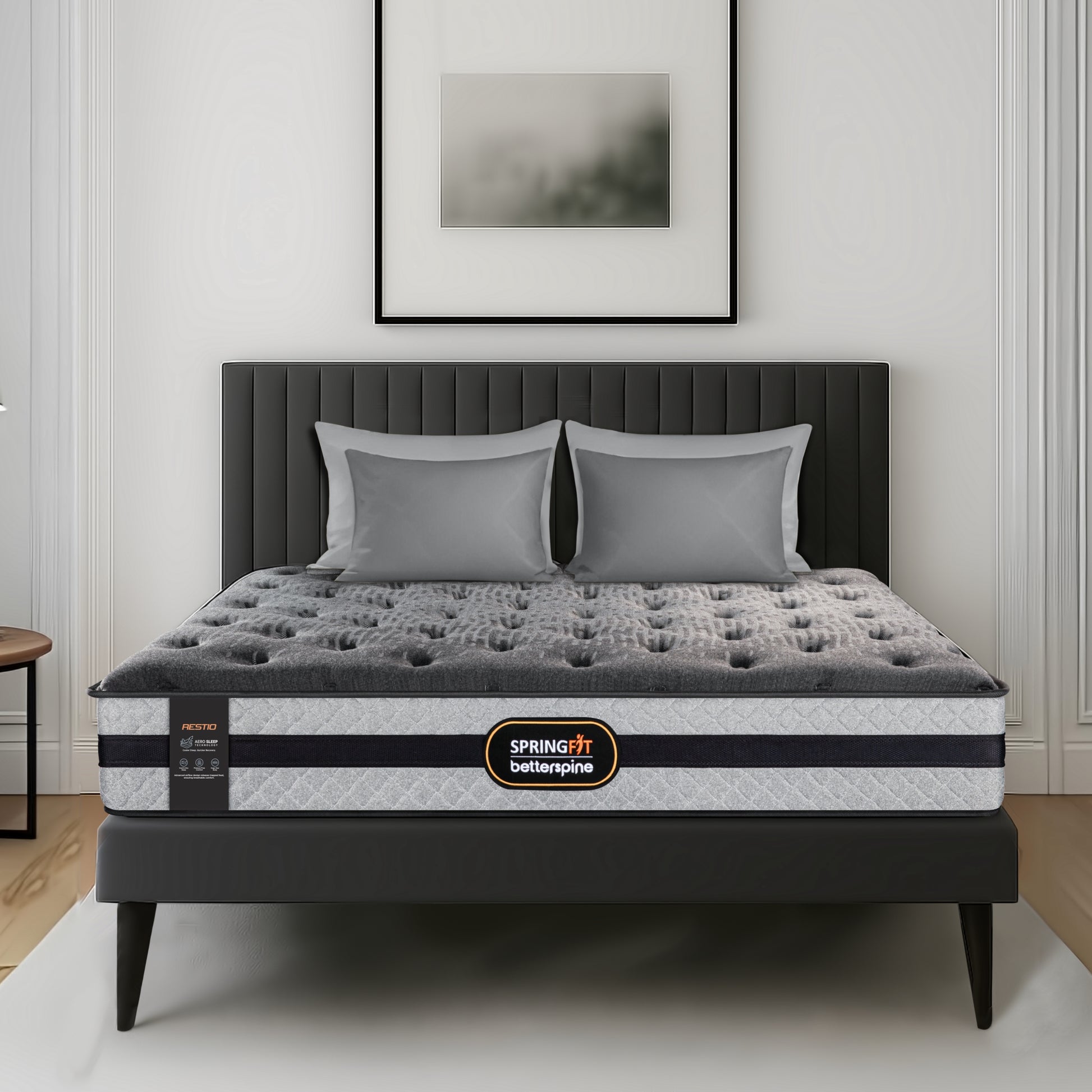 Front view of Springfit BetterSpine Restio mattress with grey pillows on a dark upholstered bed frame