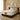 Angled lifestyle view of Springfit Emporio Grand Royce mattress with ornate white fabric top and brown accent trim on dark platform bed in a beige luxury bedroom