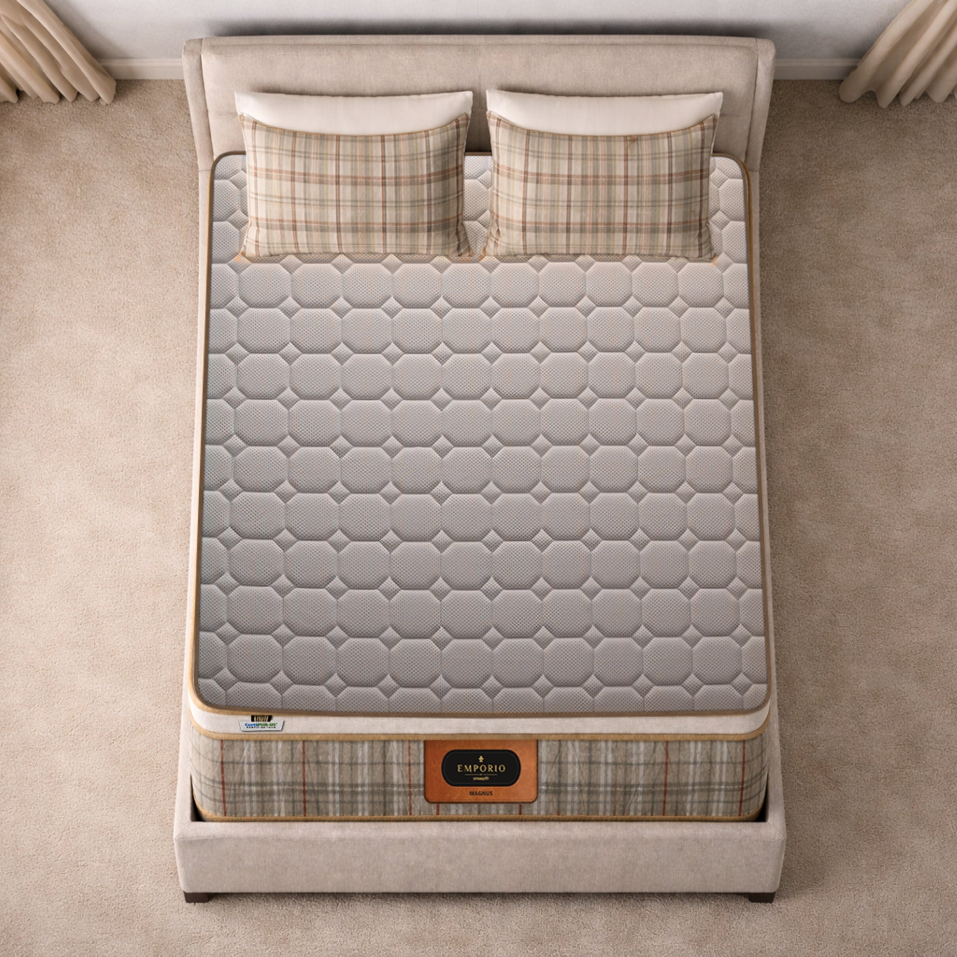Overhead top-down view of the Springfit Emporio Magnus mattress showing its full grey geometric octagon-quilted fabric surface on a beige upholstered bed with two plaid pillows
