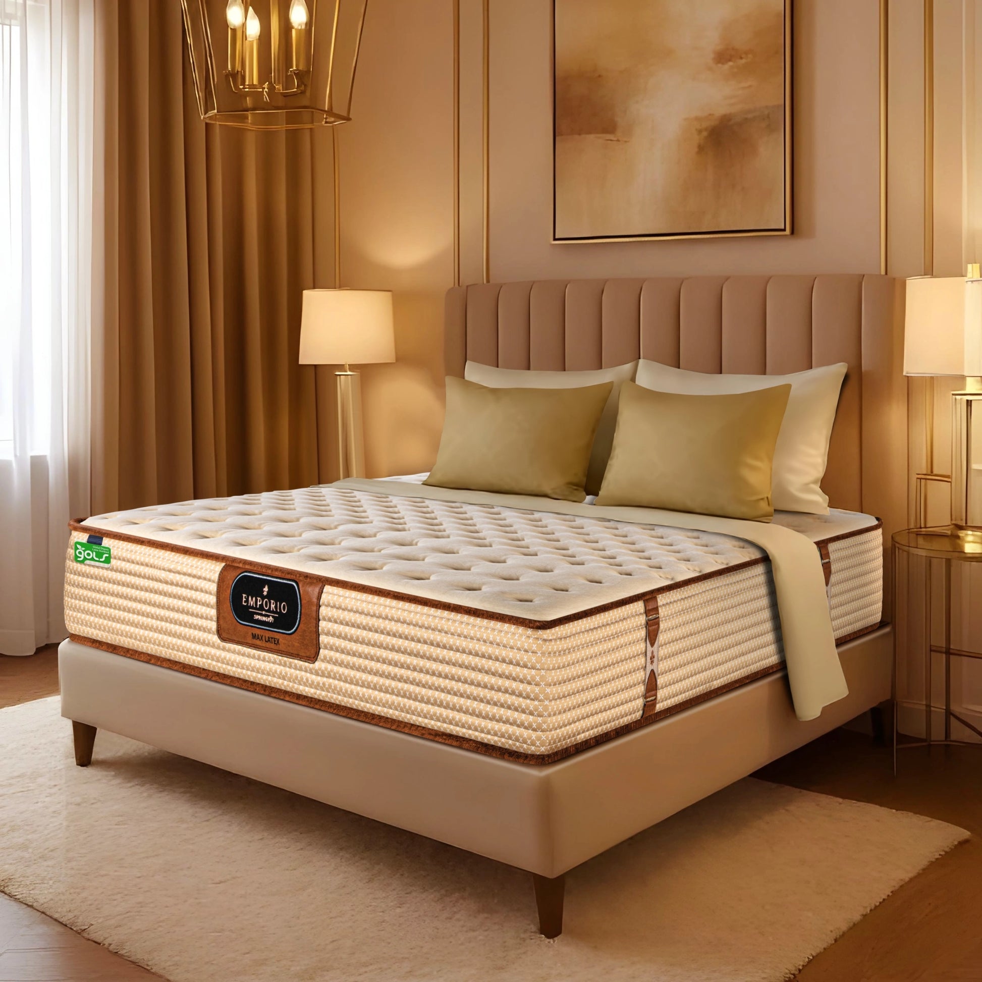 Angled lifestyle view of Springfit Emporio Max Latex mattress with cream tufted top on a beige upholstered bed frame in a warm gold-toned luxury bedroom