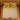 Top-down view of Springfit Emporio Max Latex mattress showing premium cream velour tufted fabric surface with yellow and beige accent pillows