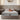 Front view of Springfit iSleep Black mattress with cream quilted pillow top and terracotta accent pillows on a beige upholstered bed in a neutral bedroom