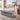 Springfit iSleep Ortho mattress on a grey upholstered bed in a bright modern bedroom, with a brand ambassador in a floral dress presenting the product