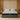 Front-facing view of the Springfit Memory Foam mattress with a light grey melange fabric top and dark charcoal woven base, on a low wooden platform bed in a warm wood-panelled bedroom with gold pendant lamps and matching nightstands