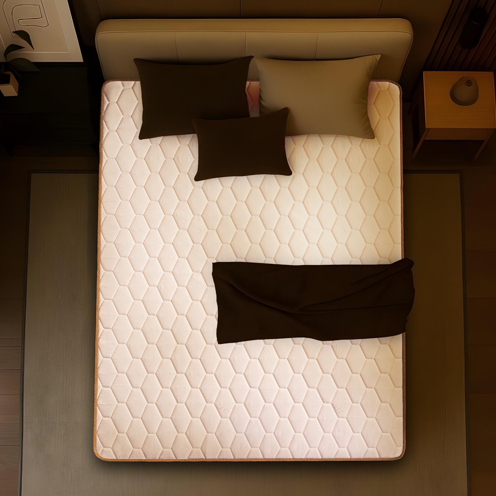 Springfit ProActiv Back mattress aerial top view on upholstered bed with dark brown pillows and blanket in warm-toned bedroom setting