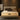 Springfit ProActiv Back mattress on beige upholstered bed with padded headboard in warm brown-toned modern bedroom with dark cushions