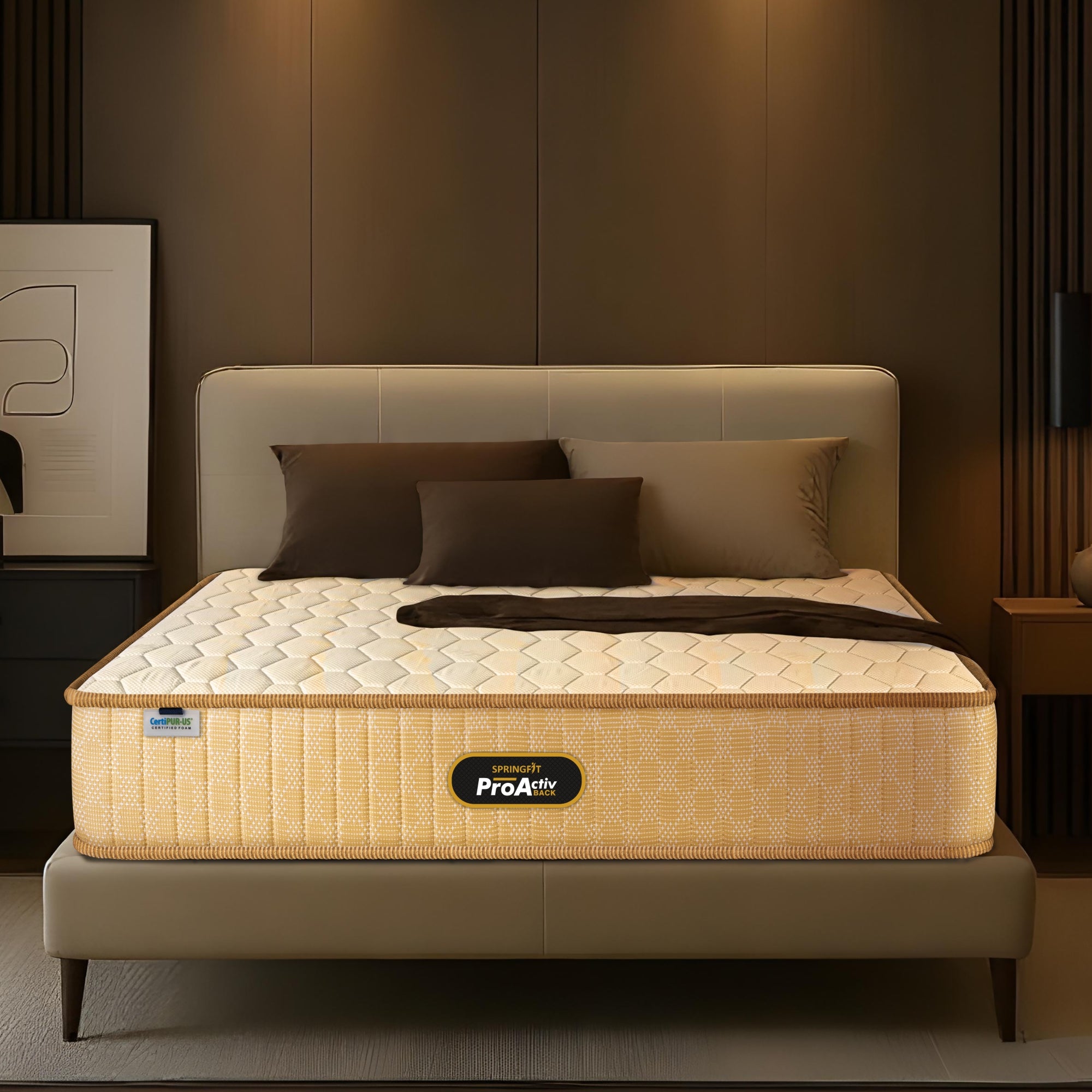 Springfit ProActiv Back mattress on beige upholstered bed with padded headboard in warm brown-toned modern bedroom with dark cushions