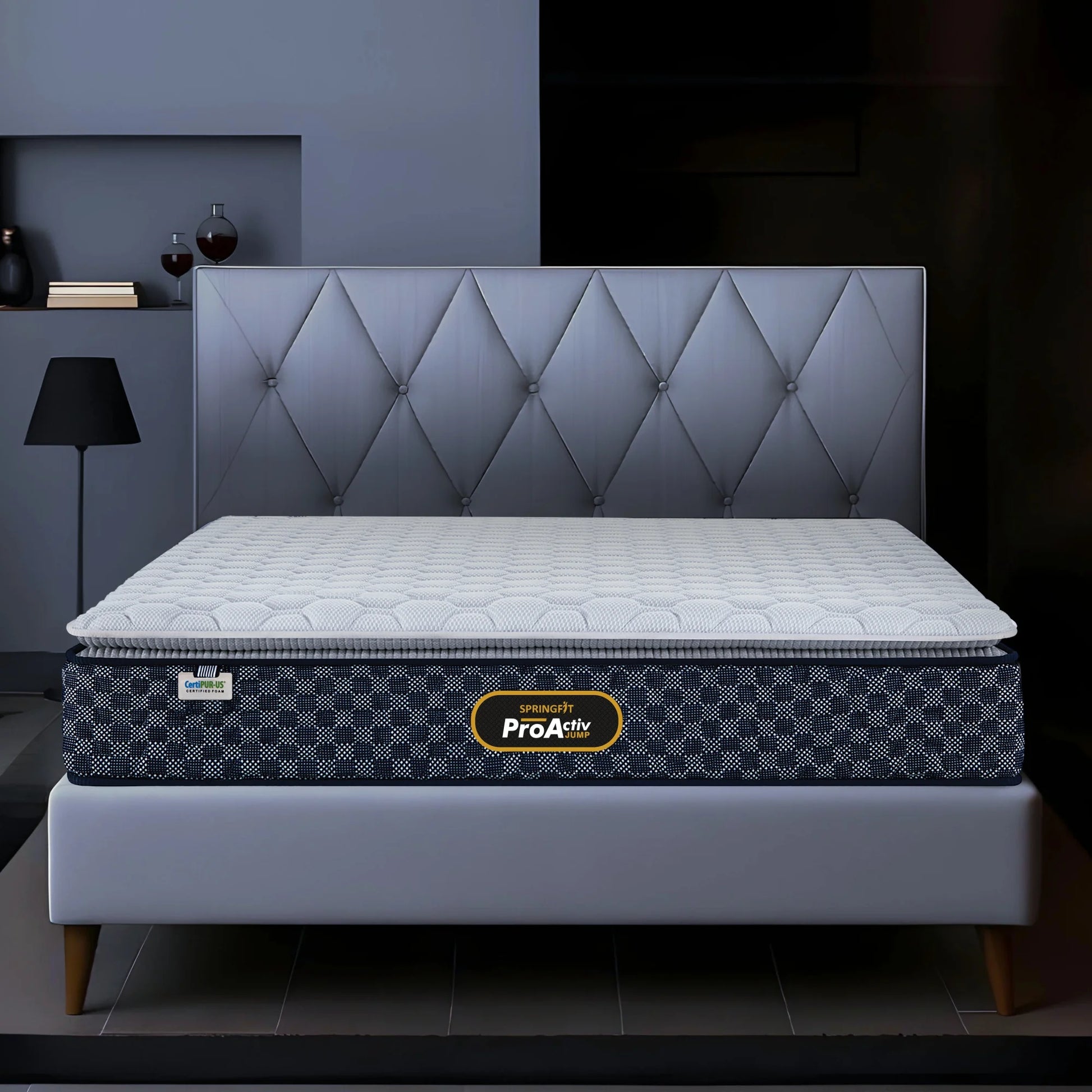 Springfit ProActiv Jump mattress on grey upholstered bed with diamond tufted headboard in modern dark bedroom setting, front view