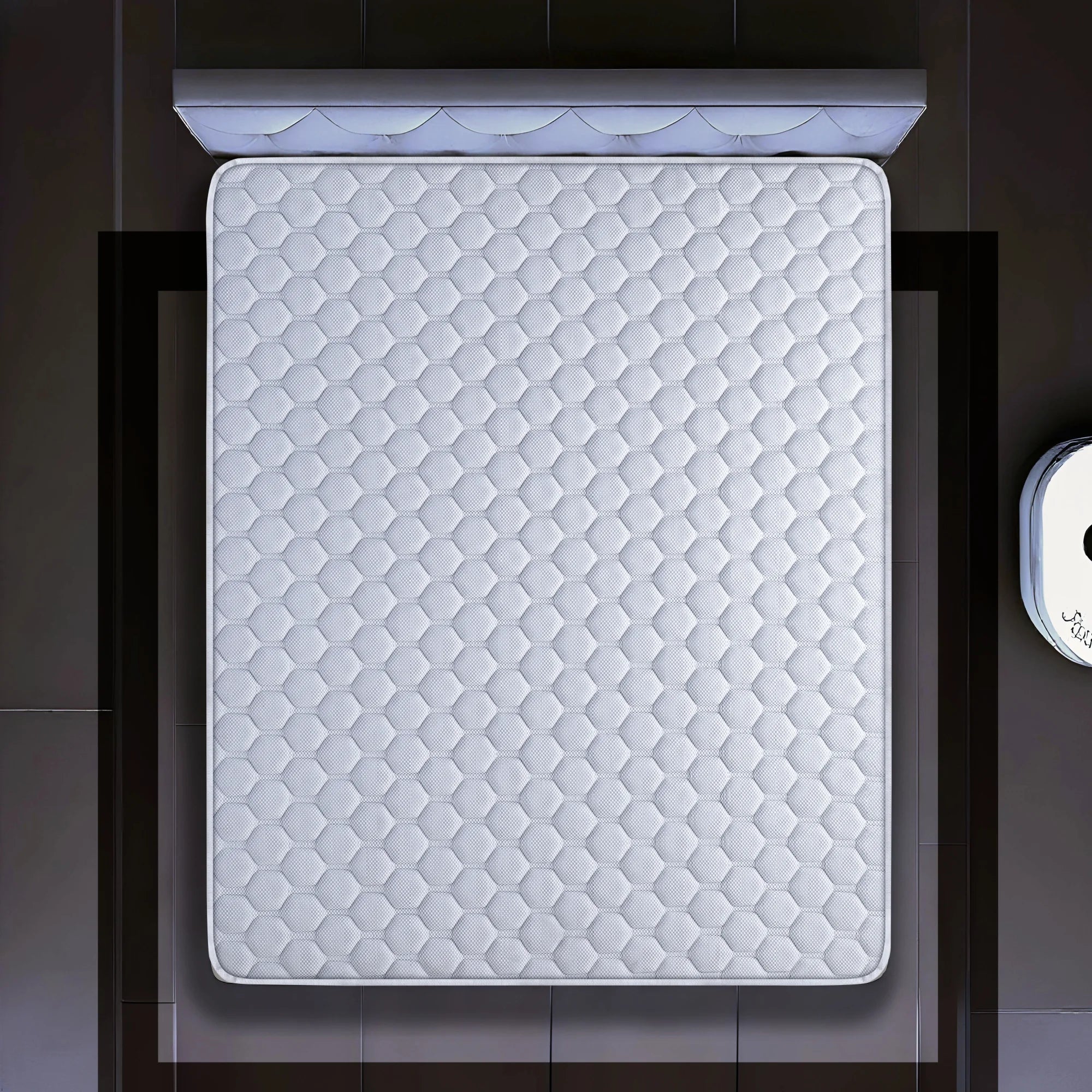 springfit ProActiv Jump mattress aerial top view displaying hexagonal quilted white fabric pattern on dark platform bed