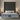 Front-facing view of the Springfit Reactive Classic mattress with a white wave-quilted top, dark grey border trim, and grey wave-textured fabric base, on a beige platform bed flanked by silver cylinder table lamps and a tall dark channelled headboard