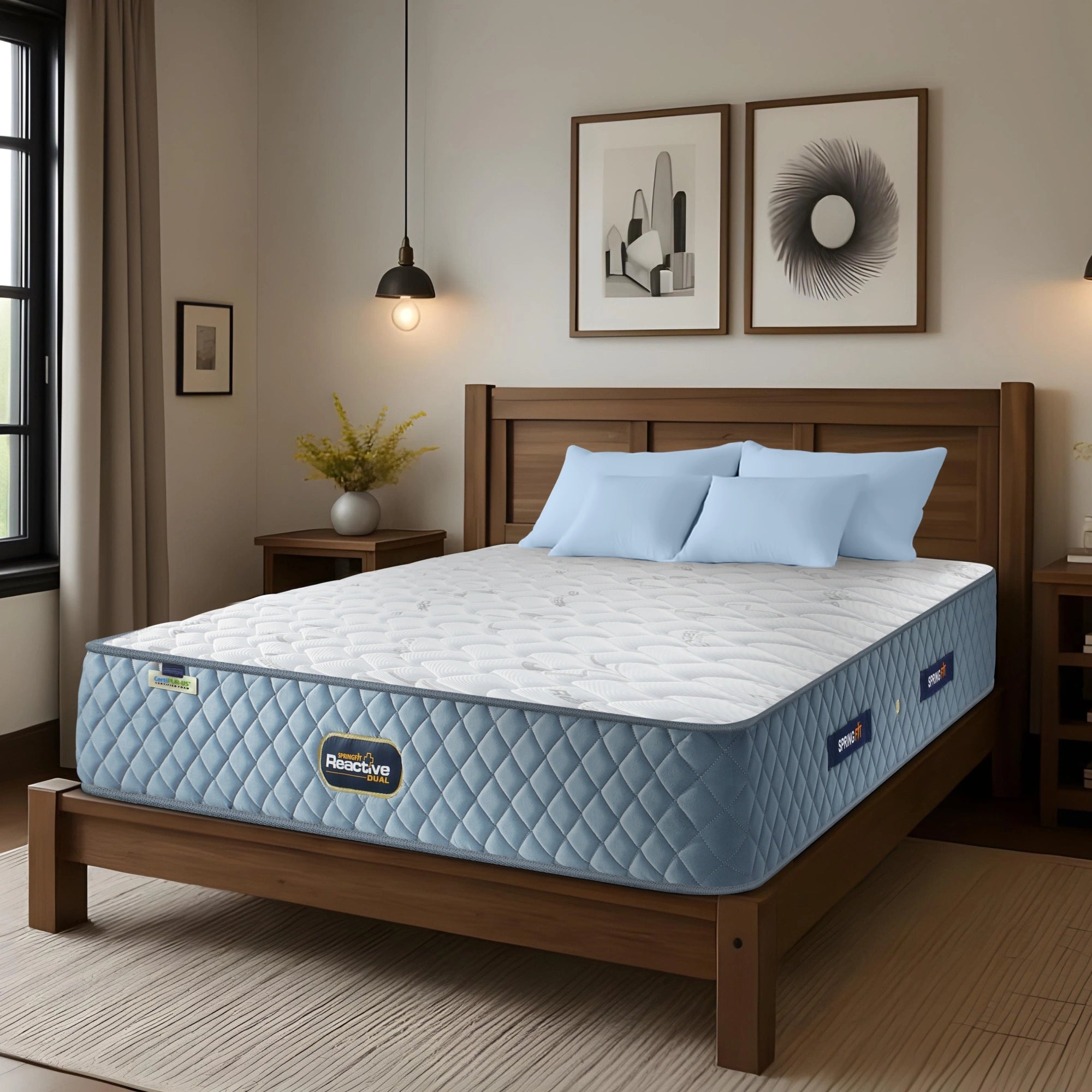 Springfit Reactive Dual mattress on solid wooden bed frame with light blue pillows in warmly lit Scandinavian-style bedroom with pendant light and potted plant