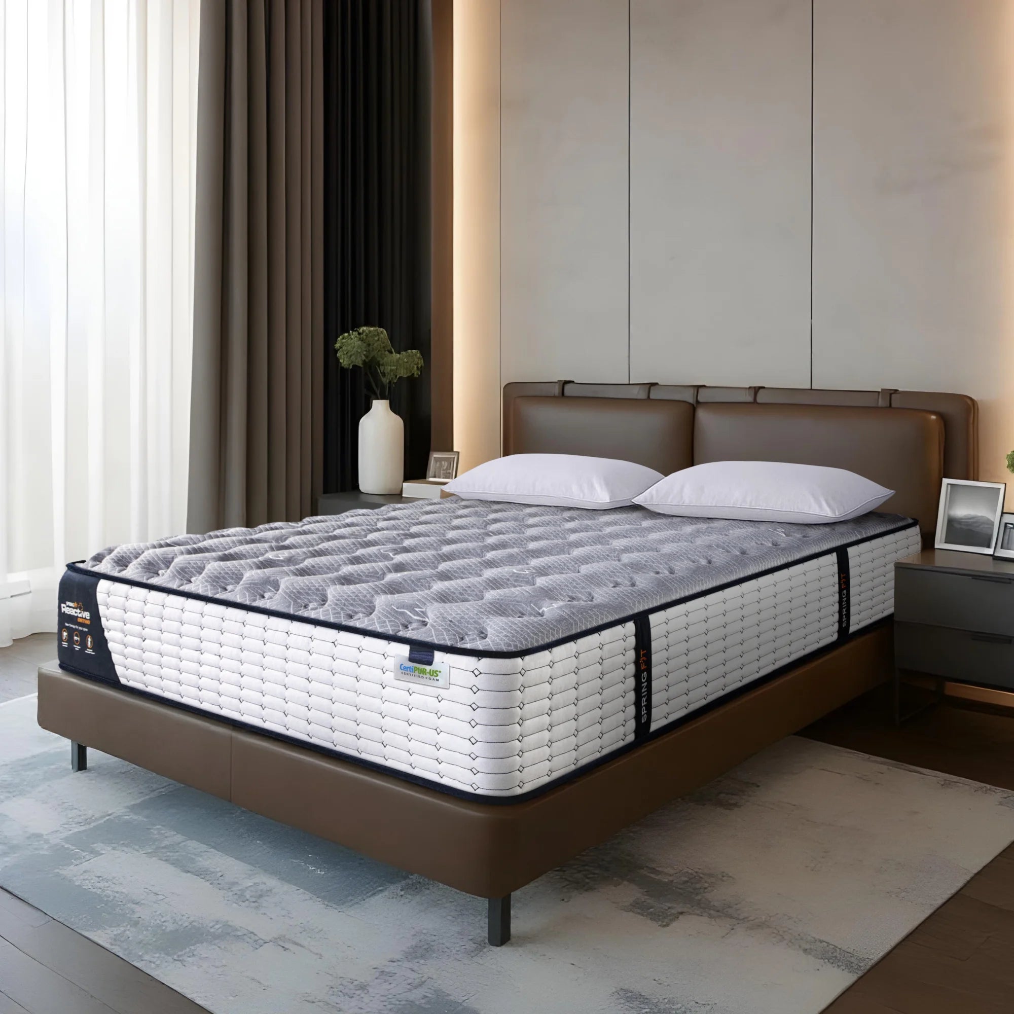 Springfit Reactive Ortho mattress on brown leather platform bed with white pillows in warmly lit luxury bedroom with sheer curtains, decorative vase, and dark nightstand