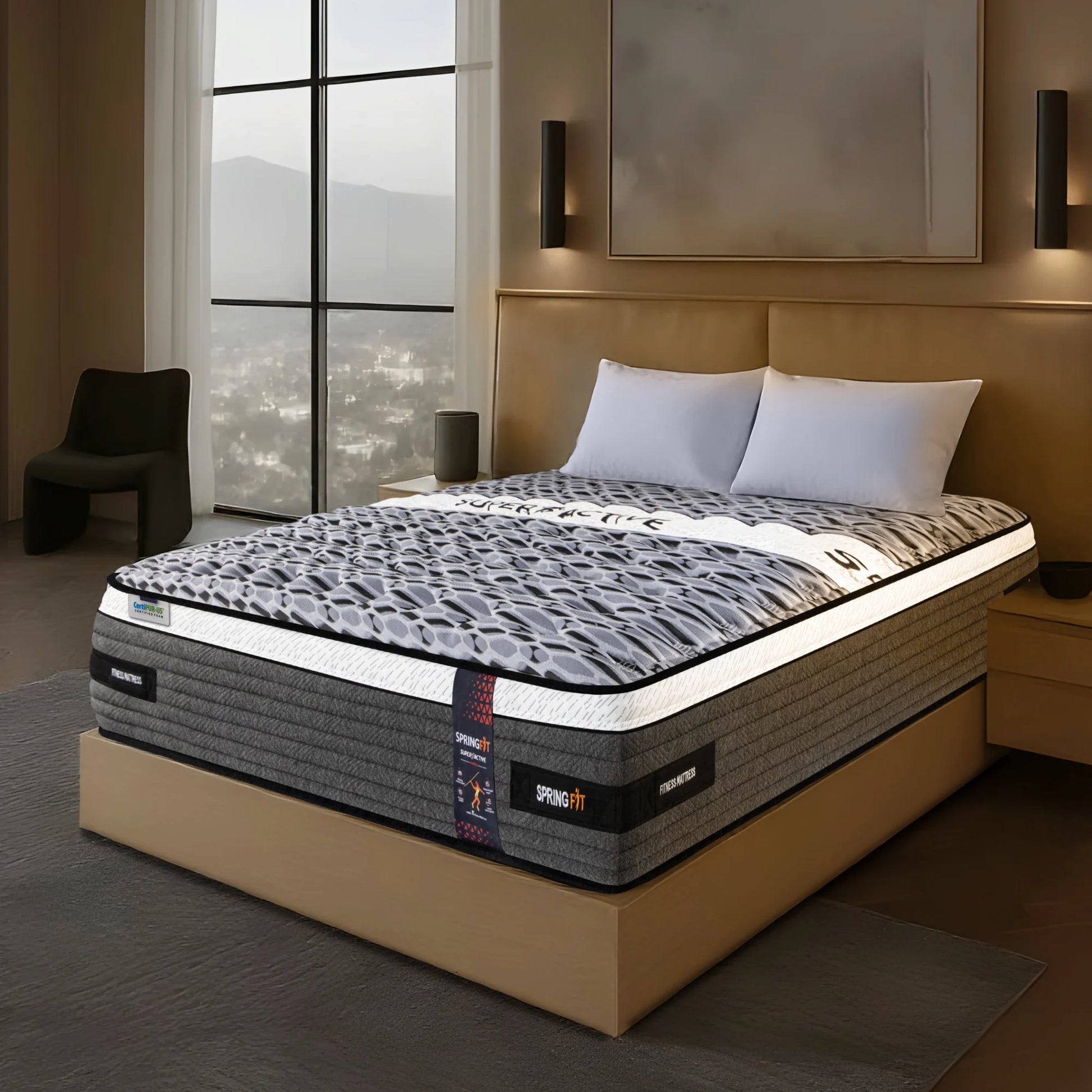 Angled lifestyle view of Springfit Super Active Hybrid fitness mattress with bold leopard-style print fabric on a beige platform bed in a modern bedroom with mountain view