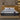 Front view of Springfit Super Active Hybrid fitness mattress with geometric dark fabric top on a beige platform bed with white pillows in a warm-toned bedroom