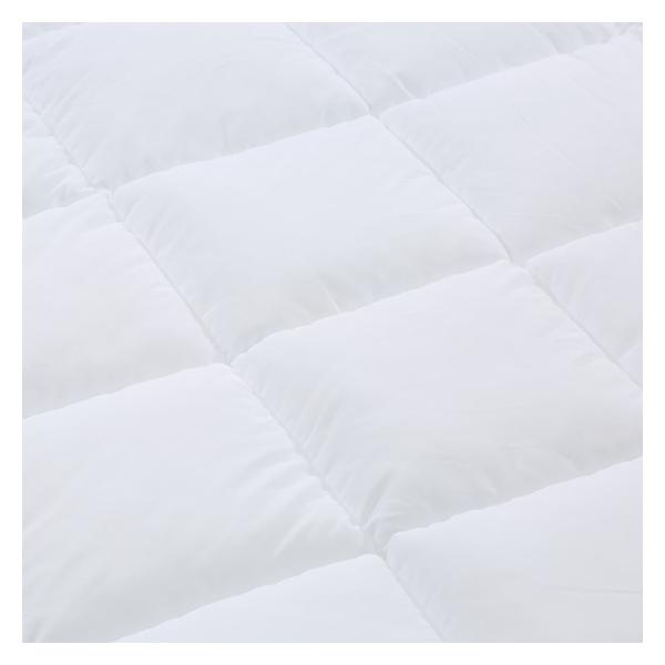 Macro close-up of Springfit Platinum Quilt surface showing deep baffle box channel-stitched fill pockets and plush white quilted texture